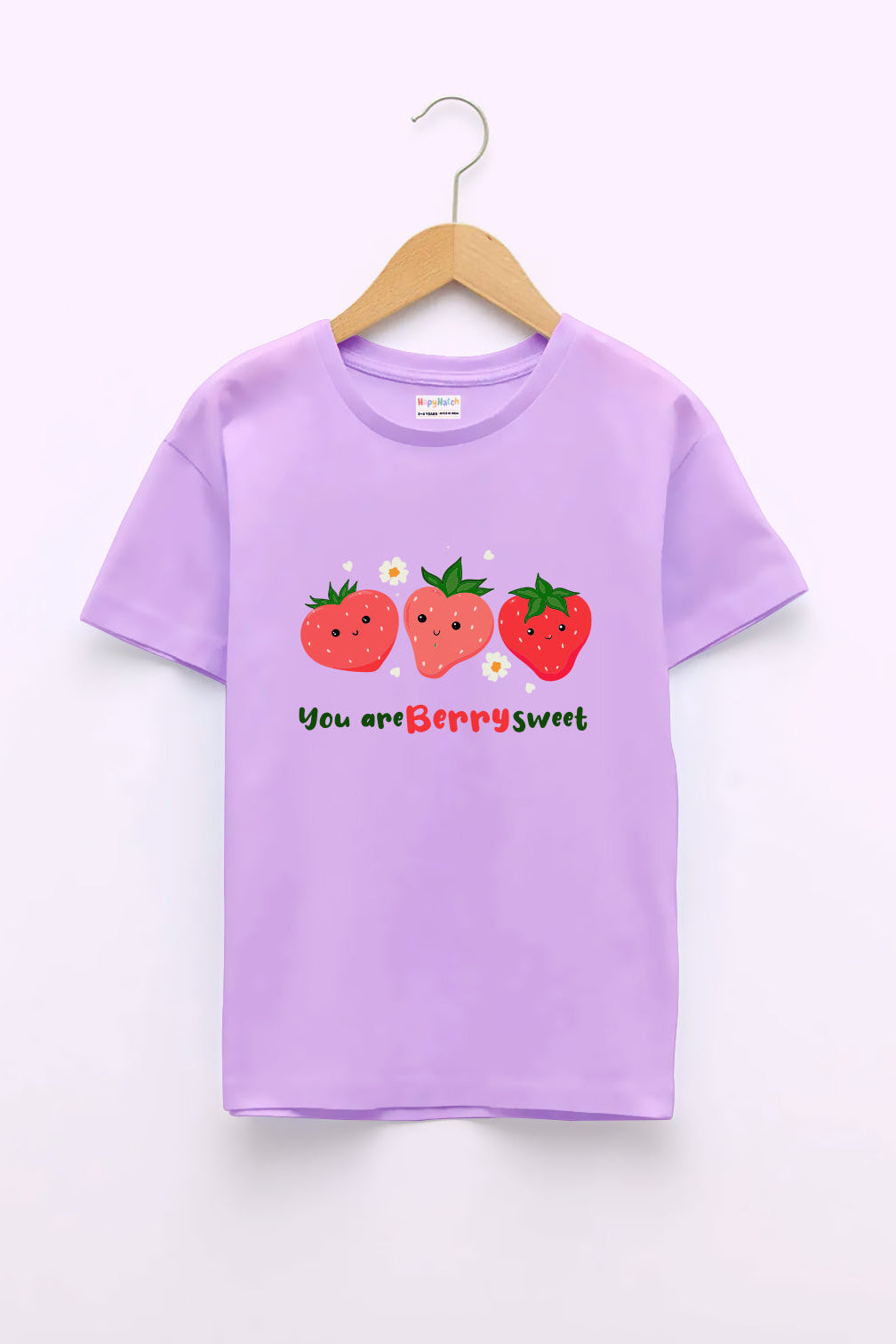 A lavender-colored crew neck T-shirt with the text 'You are Berry Sweet' and an illustration of three strawberries printed on the front.