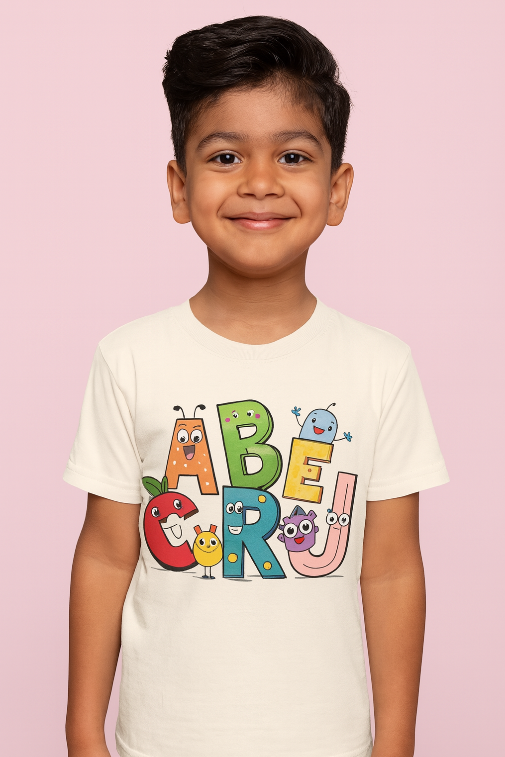 Child wearing a white t-shirt with colorful letters on a pink background