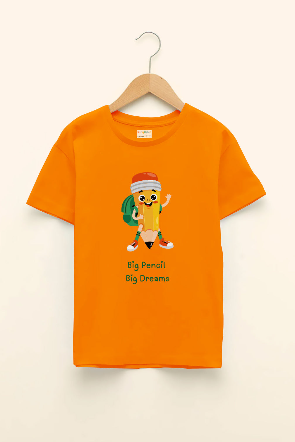 An orange round neck t-shirt with a graphic print of a big pencil character and the text 'Big Pencil Big Dreams'.