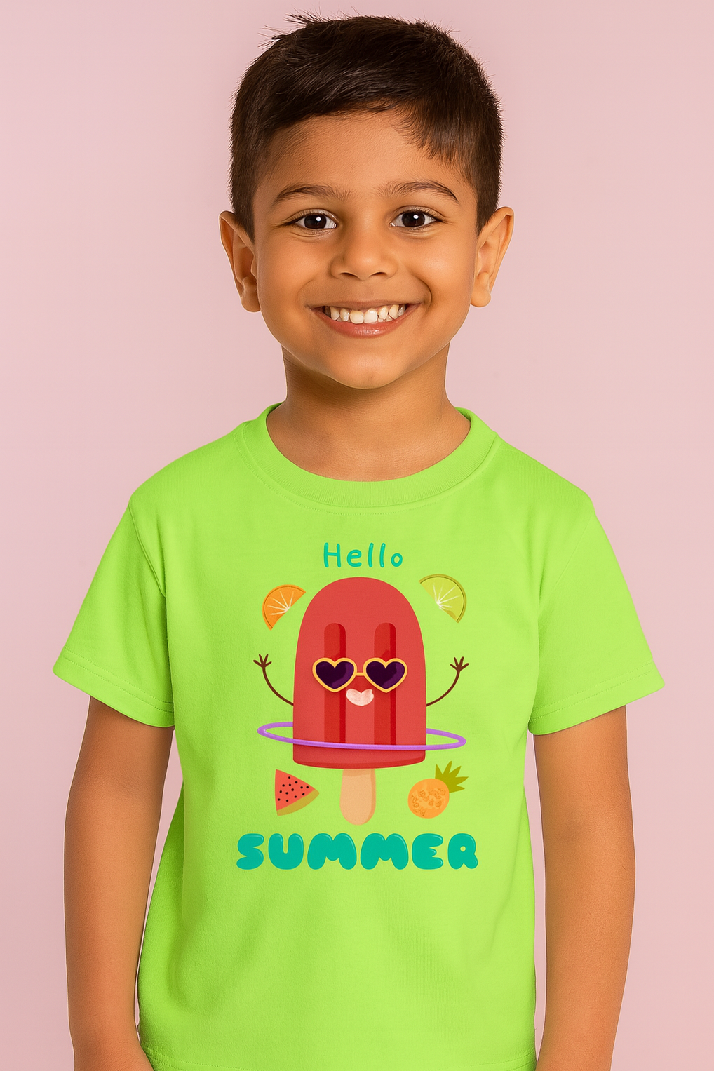 Child wearing a green t-shirt with a summer-themed design on a pink background
