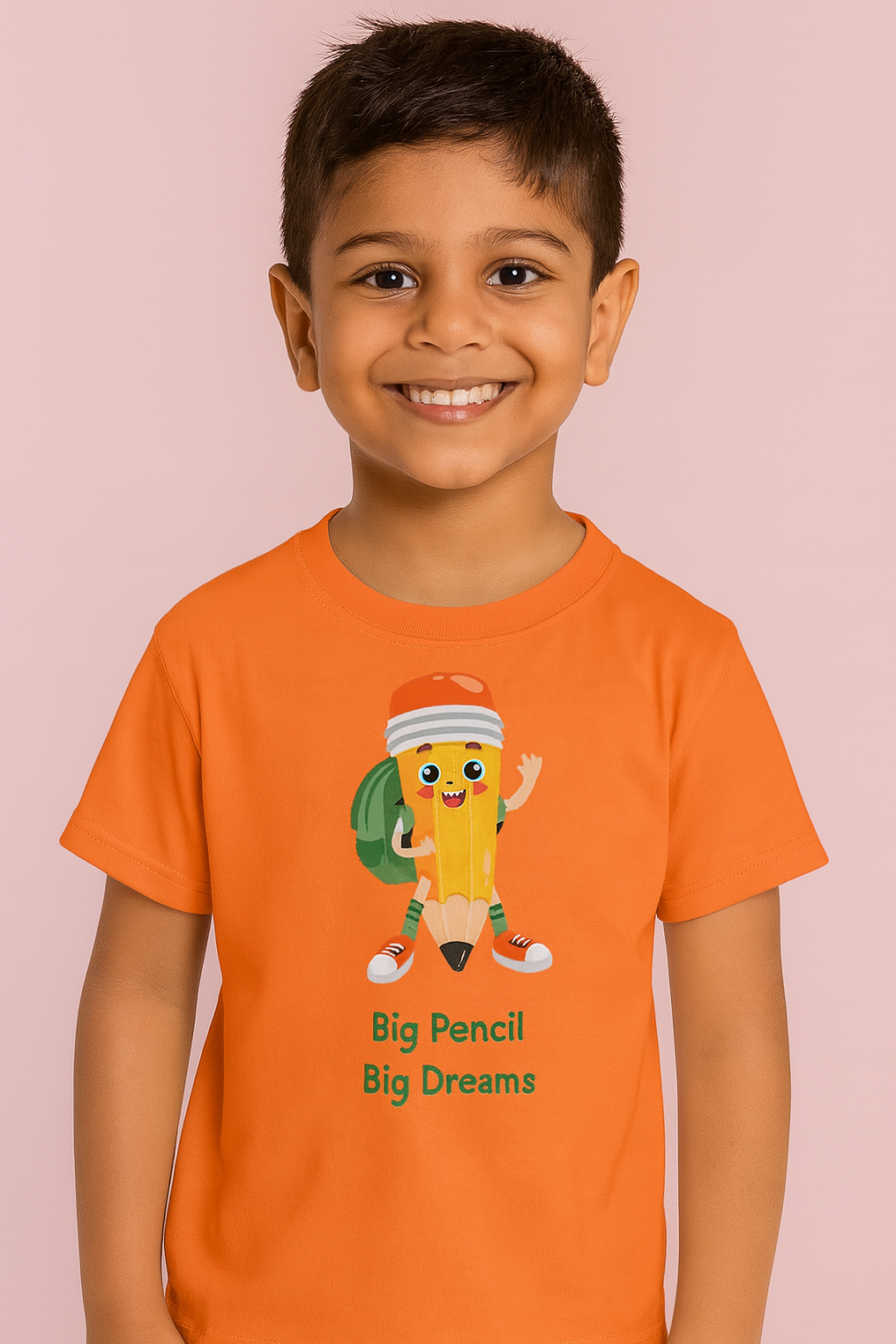 Child wearing an orange t-shirt with a pencil character and text on a pink background