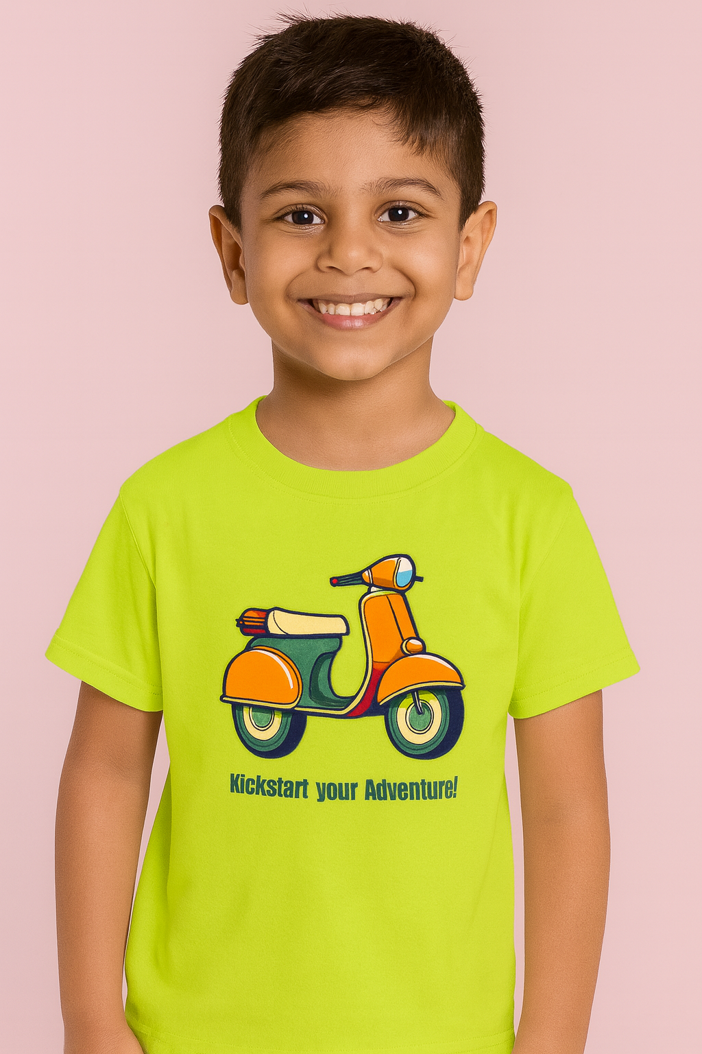 Child wearing a bright green t-shirt with a scooter graphic and text on a pink background