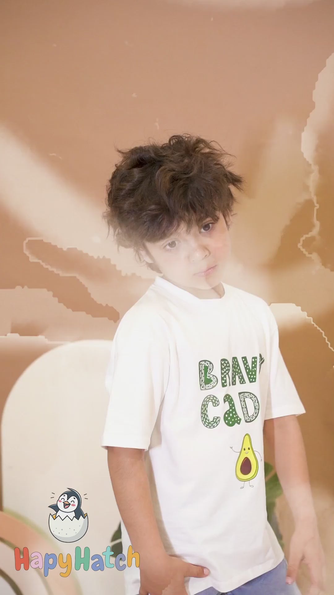 A playful video of Kid model enjoying himself in premium cotton HapyHatch T shirt